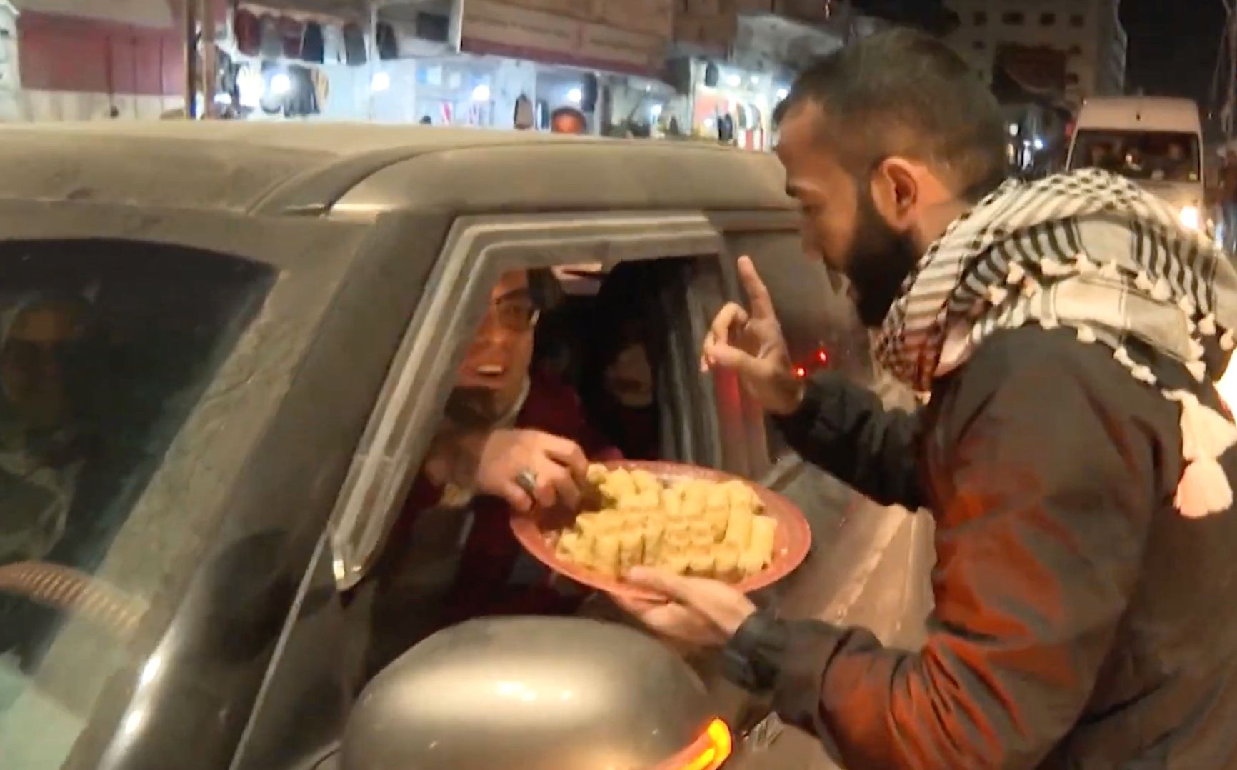 Palestinians mark successful attacks on Israelis by handing out sweets in the streets